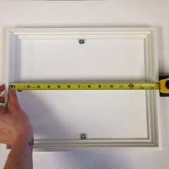 Take a photograph of your frame with the measuring tape across the front