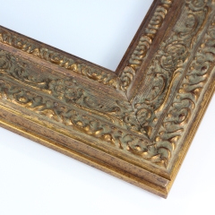 This large vintage frame features highly decorative details. The molding is Gold with hints of bronze, giving it a classic look.