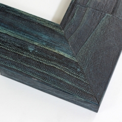 This thick 3 7/8 flat wooden frame features a rustic blue green finish. The natural barnwood texture highlights the multi coloured stain. This large deep coloured frame creates a modern and elegant spin on a classic, simple frame.