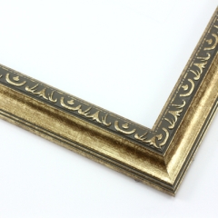 This classic, Victorian-style frame features a solid wood, reverse scoop profile.  The relief-detailed inner lip and sloped face are a textured gold foil, edged in a subtle bevel.

1.25 " width: ideal for small images. Border an acrylic or oil painting or print with this antiqued, high fashion frame.