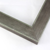 Slightly angled 1-5/8 " frame with an indented design on the inner and outer edge. The face is metallic silver stain brushed over a dark grey base. The accented inner and outer edge reveal a mint green patina which highlights the difference in texture.