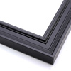 This matte black, ornately ridged crown moulding frame features a steep outer edge that cascades in curved steps into a flat valley.  The inner lip rises again in a gentle, bevelled curve.

1.7 " width: ideal for medium size artworks.  Select a bold painting or giclee print that can compete with this busy frame, or a strong photograph for a more modern take on this classic style.