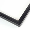 This thin matte black frame features a 3/4 " profile, with a slightly raised outer edge, and slightly angled profile.