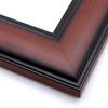 This wide frame features a smooth curve with bevelled inner and outer rims. The walnut wash has a wood grain detail, and fades to black at the edges.

3 " width: ideal for large and oversize artwork. Allow the rustic wood face to highlight a bucolic nature painting or photograph, or match the black edges to a contemporary print.