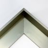 This metal canvas floater picture frame has a smooth, matte Dark Champagne finish and flat, narrow (.25 ") face.
Ideal for medium to large size artwork on thick (1-5/8 " deep) stretcher bars. Border gallery wrapped Giclée canvas prints or paintings with this simple, modern frame for an authentic, fine art display.
*Note: These sturdy metal, custom canvas floaters are for stretched canvas prints and paintings, and raised wood panels.
Nielsen mf14-14 Profile