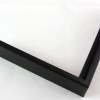 Slim 5/16 " metal frame. This frame comes in solid mars black. The face has a frosted texture and reflects dispersed light. The profile features a horizontal brushed texture.

Nielsen n22-21 Profile