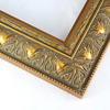 This classic wide gold frame features ornate leaf detailing on a 2-1/2 " curved profile. This frame adds an elegant and antique aesthetic to your artwork.