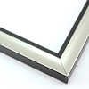 This simple, bold frame features scoop profile and silver foil face.  The inner lip is stepped down and painted a matte black, to match the outer drop edge.

1.25 " width: ideal for small or medium size artworks. Due to it